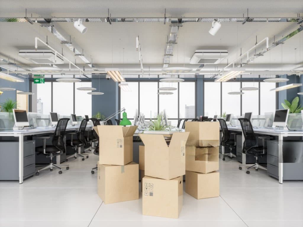 Packed office furniture and IT equipment ready for office relocation