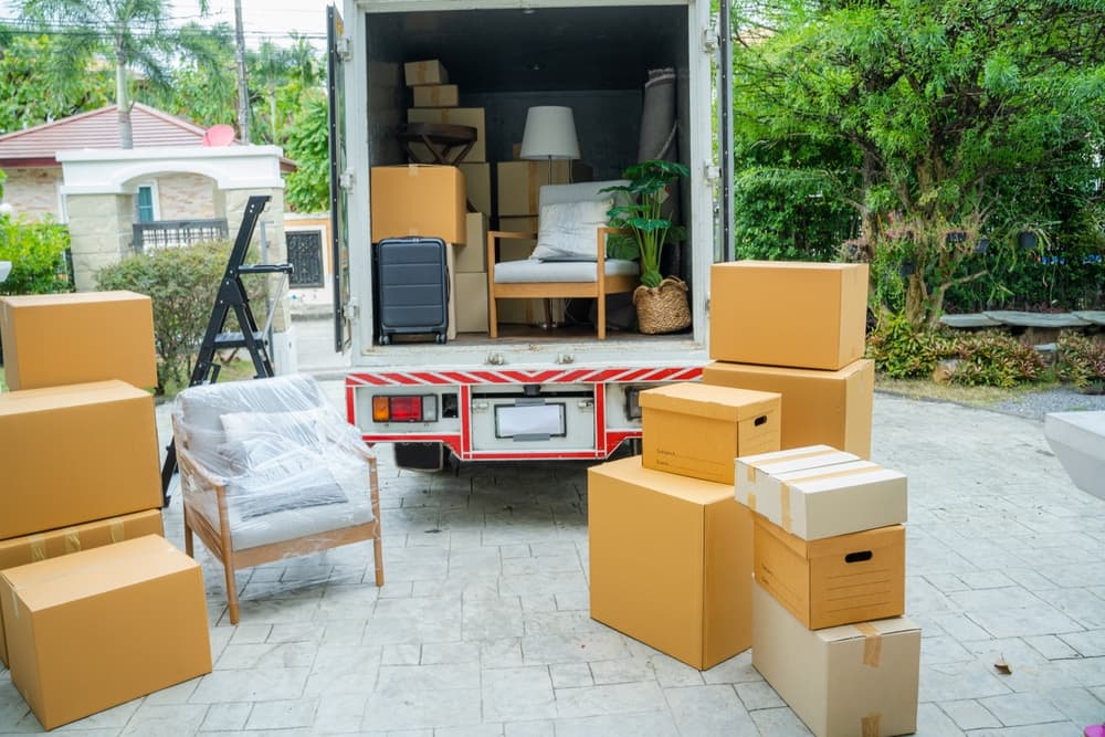 Household furniture and moving boxes prepared for home relocation